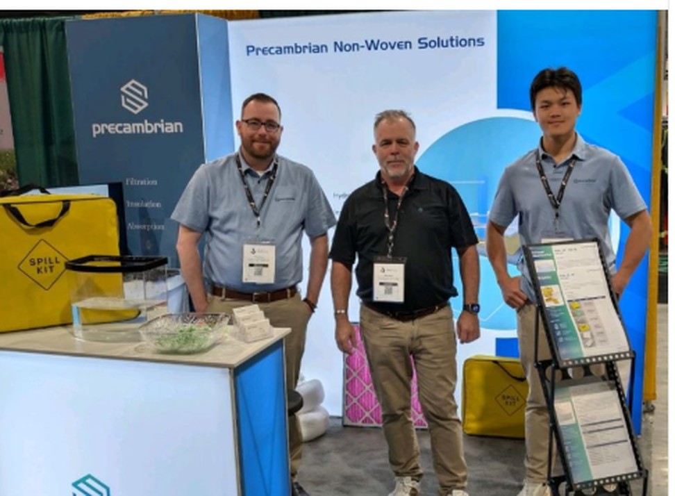 The Precambrian team at booth 247, Saskatchewan Oil and Gas Show, Weyburn, with GreenStrength spill kits and filter media on display