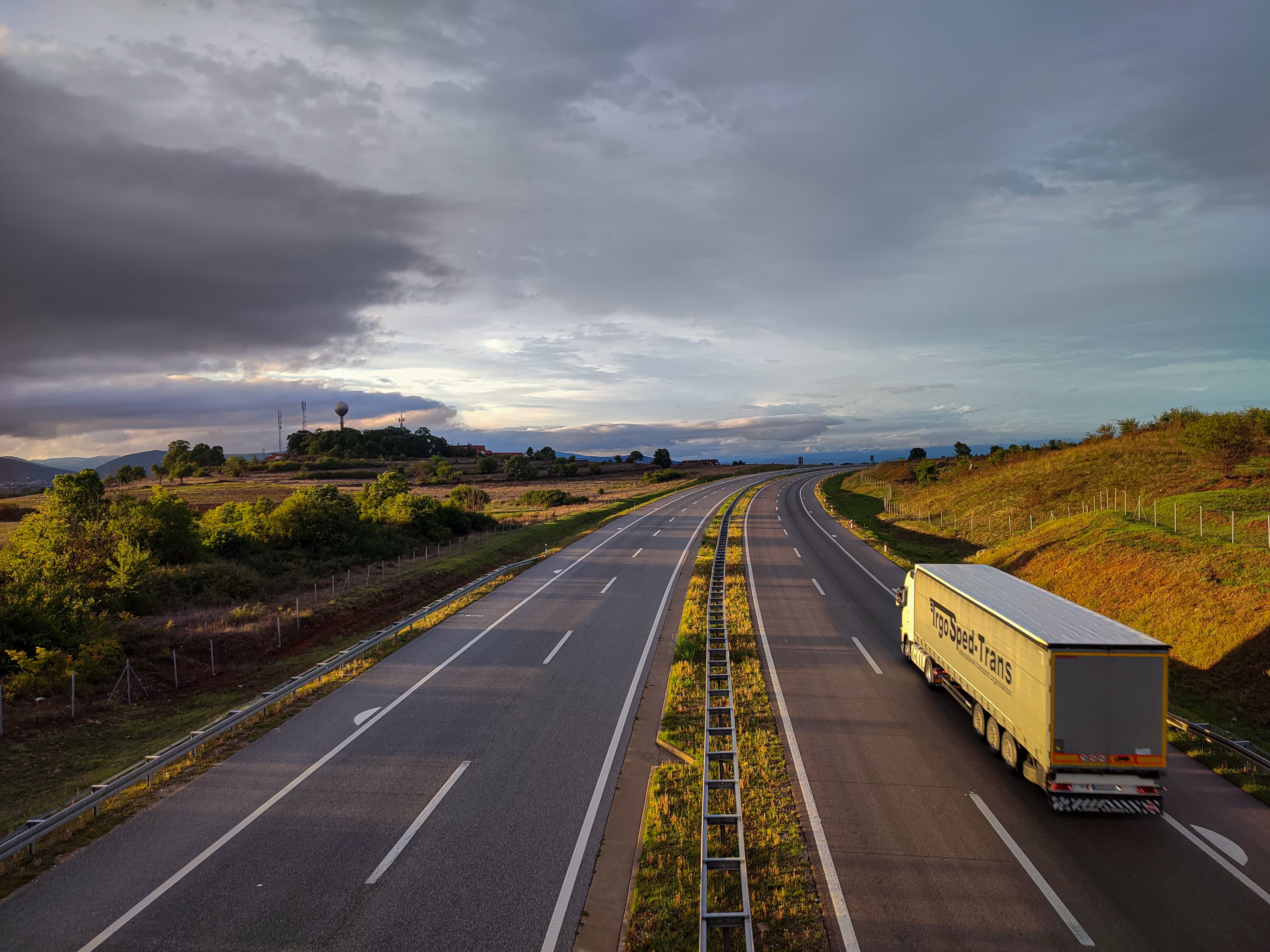 Transport truck on a highway at sunset